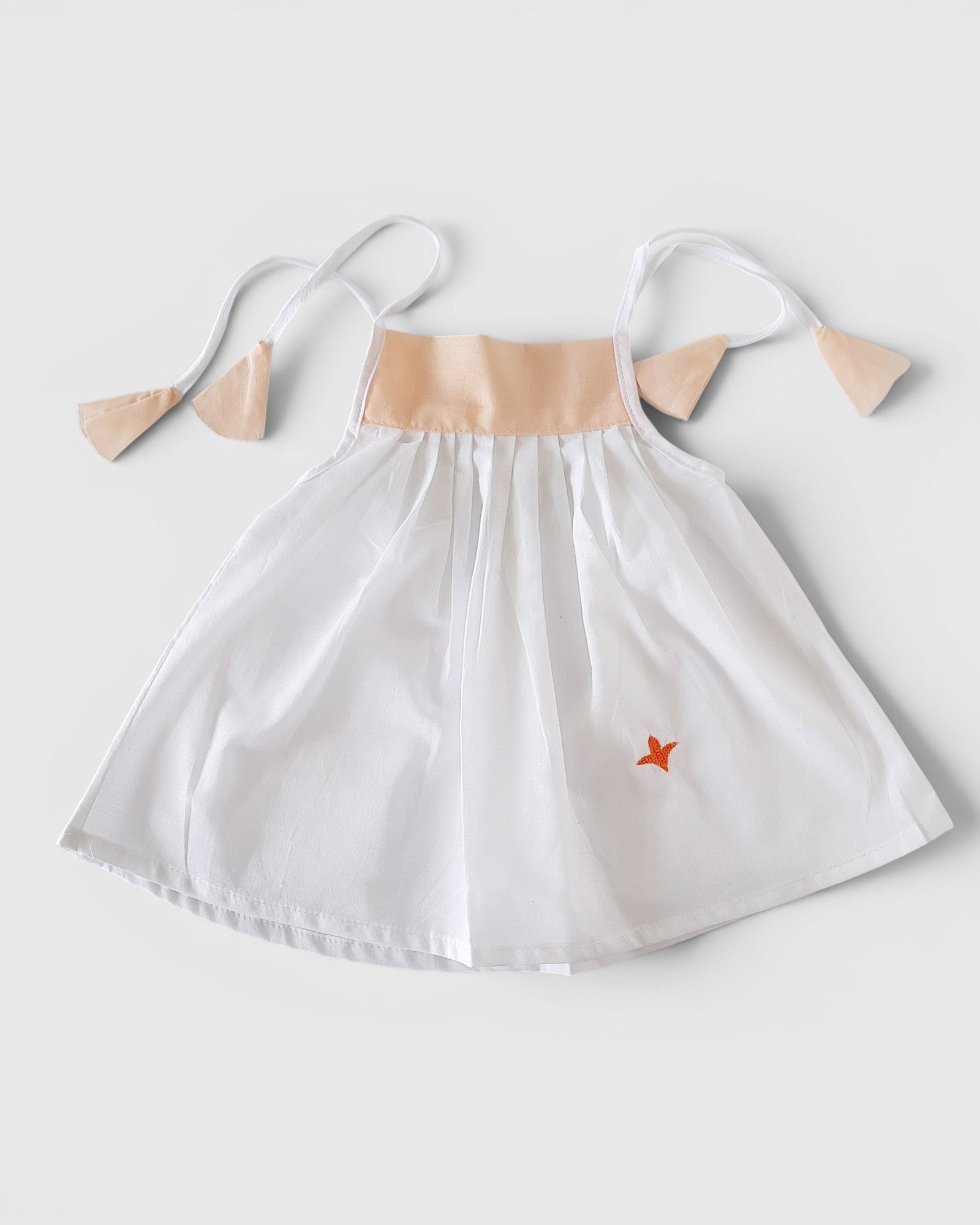 Pure Cotton Newborn Baby Girl Frock – White Dress with Peach Tie-Up Straps | Soft, Lightweight & Breathable